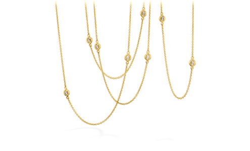 A yellow gold station necklace from Hearts on Fire, available at Chrono Jewelry.