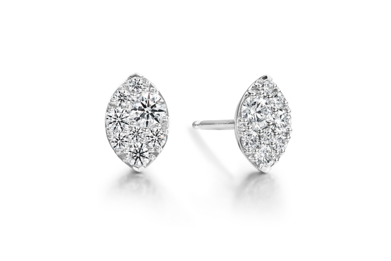 A pair of silver diamond studs with dazzling diamonds of different sizes close together.