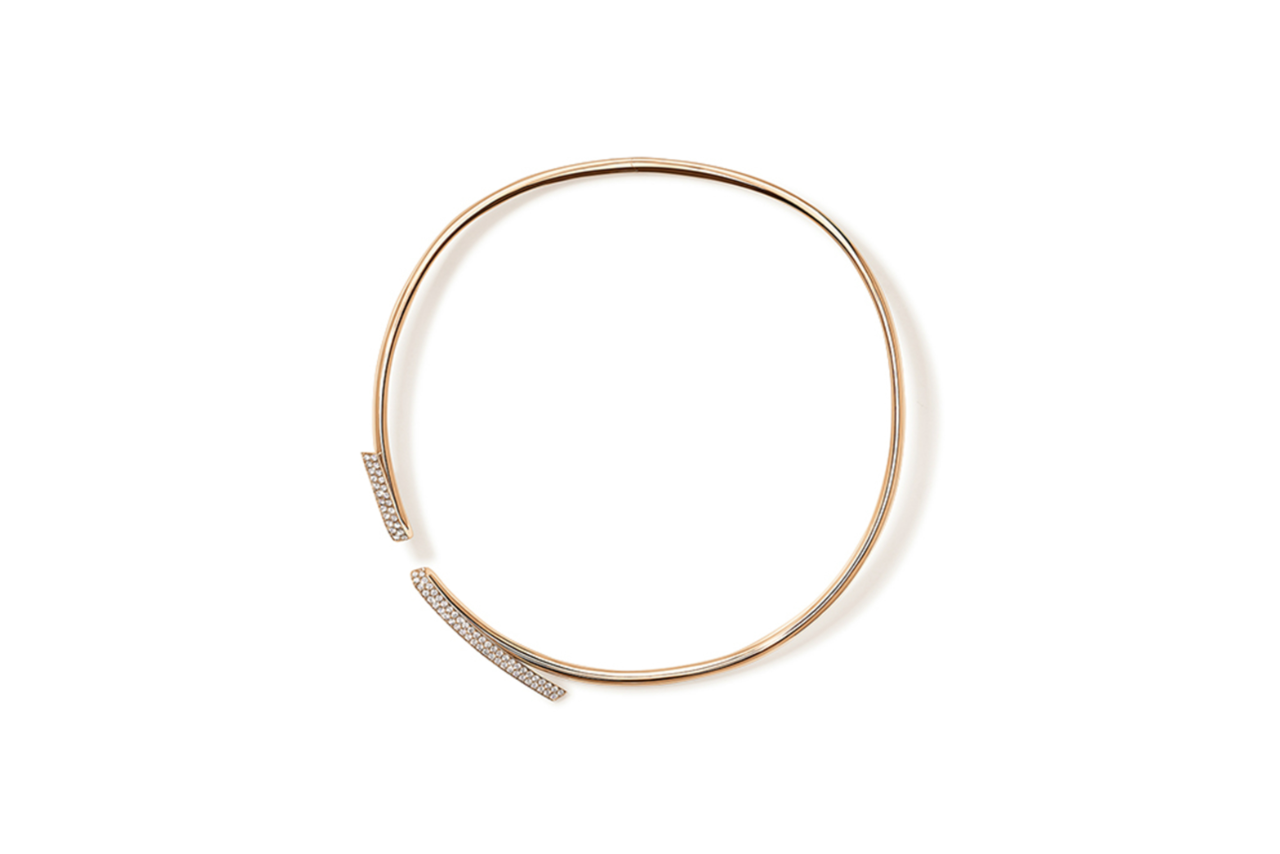 A structured rose gold necklace with diamond accents.