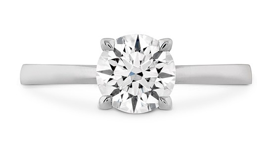 a white gold solitaire engagement ring with a round cut center stone