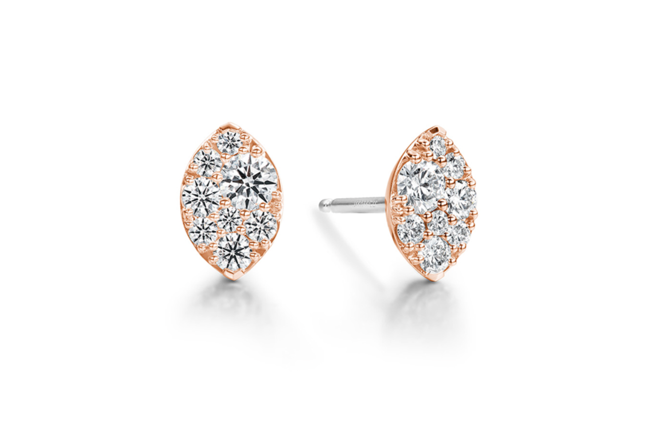 A pair of rose gold studs adorned with diamonds in varying sizes.