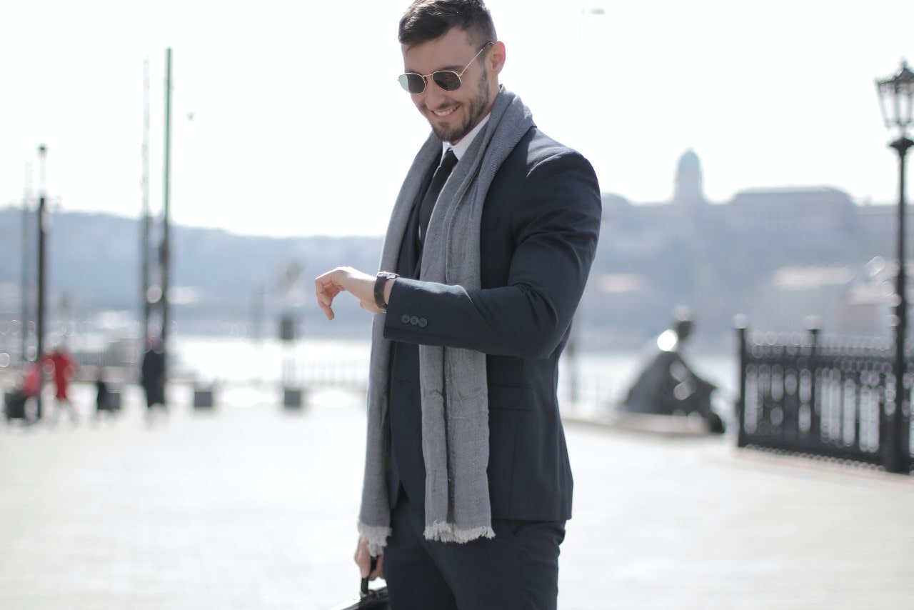 man wearing stylish clothes and a luxury watch man wearing stylish clothes and a luxury watch